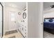 Modern bathroom with double vanity, walk-in shower, and access to bedroom at 6709 Ranger Dr, Tampa, FL 33615