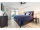 Spacious bedroom with a king-size bed and access to a patio at 6709 Ranger Dr, Tampa, FL 33615