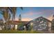 Attractive single-story home with landscaped yard and two-car garage at 6709 Ranger Dr, Tampa, FL 33615