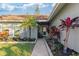 Inviting front entry with walkway and colorful landscaping at 6709 Ranger Dr, Tampa, FL 33615