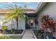 Inviting front porch entry with lush landscaping and a sitting area at 6709 Ranger Dr, Tampa, FL 33615