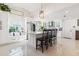 Modern kitchen with breakfast bar, stainless steel appliances, and built-in seating at 6709 Ranger Dr, Tampa, FL 33615