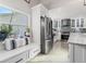Bright kitchen with stainless steel appliances and built-in window seat at 6709 Ranger Dr, Tampa, FL 33615