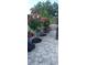 Landscaped pathway with flowering trees and pathway lighting at 6709 Ranger Dr, Tampa, FL 33615