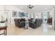 Open living room with comfortable seating and a large TV at 6709 Ranger Dr, Tampa, FL 33615