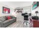 Home office with a comfortable couch and a workspace at 6709 Ranger Dr, Tampa, FL 33615