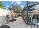 Enclosed pool area with patio furniture and a spacious deck at 6709 Ranger Dr, Tampa, FL 33615
