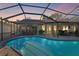 Inviting pool area with covered patio and seating at 6709 Ranger Dr, Tampa, FL 33615