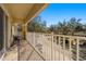 Private balcony overlooking a tree-lined street at 7001 Interbay Blvd # 313, Tampa, FL 33616