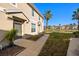 Townhouse exterior with walkway, landscaping, and a view of a lake at 7001 Interbay Blvd # 313, Tampa, FL 33616