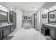 Large Primary bathroom with double sinks, soaking tub, and shower at 10126 Londonshire Ln, Tampa, FL 33647