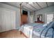 Spacious bedroom with a four-poster bed and private door at 10126 Londonshire Ln, Tampa, FL 33647
