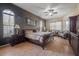 Main bedroom with wood floors and a sitting area at 10126 Londonshire Ln, Tampa, FL 33647