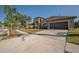 House exterior with a driveway and landscaping at 10126 Londonshire Ln, Tampa, FL 33647