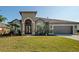 Beautiful one-story home with a two-car garage and manicured lawn at 10126 Londonshire Ln, Tampa, FL 33647
