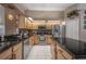 Modern kitchen featuring stainless steel appliances and granite countertops at 10126 Londonshire Ln, Tampa, FL 33647