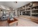Living room showcasing built-in shelving and a large TV at 10126 Londonshire Ln, Tampa, FL 33647