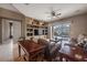 Living area with hardwood floors, built-ins, and pool access at 10126 Londonshire Ln, Tampa, FL 33647