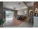Spacious living room with hardwood floors and views of the pool at 10126 Londonshire Ln, Tampa, FL 33647