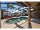 Relaxing screened-in pool and spa with ample patio space at 10126 Londonshire Ln, Tampa, FL 33647