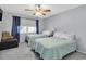 Bedroom with two twin beds and ceiling fan at 1035 Dunrobin Dr # C, Palm Harbor, FL 34684