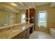 Bathroom with granite countertop, large mirror and water views at 10520 Boardwalk Loop # 503, Bradenton, FL 34202