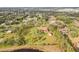 Aerial view showing home on a large lot near a pond at 10813 Dixon Dr, Riverview, FL 33579