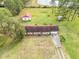 Aerial view of home with detached garage on a large lot at 10813 Dixon Dr, Riverview, FL 33579
