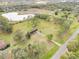 Aerial view showing home on a spacious lot near a pond at 10813 Dixon Dr, Riverview, FL 33579