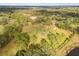 Aerial view of home on a large lot with mature trees at 10813 Dixon Dr, Riverview, FL 33579