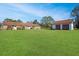 Spacious backyard with detached garage and large grassy area at 10813 Dixon Dr, Riverview, FL 33579