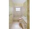 Bathroom with vintage wallpaper, bathtub, and vanity at 10813 Dixon Dr, Riverview, FL 33579