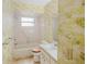 Bathroom with vintage wallpaper, bathtub, and vanity at 10813 Dixon Dr, Riverview, FL 33579
