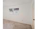 Simple bedroom with neutral carpeting and large window at 10813 Dixon Dr, Riverview, FL 33579
