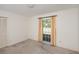 Spacious bedroom with neutral carpeting and large window at 10813 Dixon Dr, Riverview, FL 33579