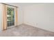 Spacious bedroom with neutral carpeting and large window at 10813 Dixon Dr, Riverview, FL 33579