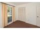 Simple bedroom with neutral carpeting and large window at 10813 Dixon Dr, Riverview, FL 33579