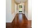 Bright entryway with wood-look tile floor and gold wallpaper at 10813 Dixon Dr, Riverview, FL 33579