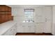 Bright kitchen with white cabinets, stainless steel appliances, and tile flooring at 10813 Dixon Dr, Riverview, FL 33579