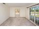 Bright living room featuring large windows, neutral walls, and a view of the backyard at 10813 Dixon Dr, Riverview, FL 33579