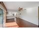 Living area with wood-look tile floor and a view of the kitchen at 10813 Dixon Dr, Riverview, FL 33579