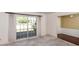 Living room with large window and neutral carpeting at 10813 Dixon Dr, Riverview, FL 33579
