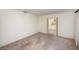 Spacious living room with wood-like tile floors and sliding glass doors leading to the backyard at 10813 Dixon Dr, Riverview, FL 33579