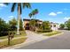 Grand waterfront home with brick driveway and lush landscaping at 111 Wateredge Ct, Safety Harbor, FL 34695