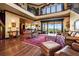 Open living space with hardwood floors, leather furniture, and water views at 111 Wateredge Ct, Safety Harbor, FL 34695