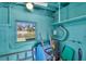Small storage room with shelving, water heater, and window at 11435 2Nd E St, Treasure Island, FL 33706