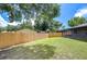 Large backyard with wooden fence at 11505 Blackbark Dr, Riverview, FL 33579