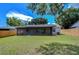 Backyard with solar panels and screened porch at 11505 Blackbark Dr, Riverview, FL 33579