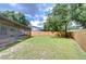 Backyard with screened porch and fenced area at 11505 Blackbark Dr, Riverview, FL 33579