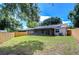 Backyard with solar panels and screened porch at 11505 Blackbark Dr, Riverview, FL 33579